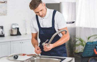 thoughtful-adult-repairman-taking-off-kitchen-fauc-2022-03-31-23-12-45-utc-copy-1024x684